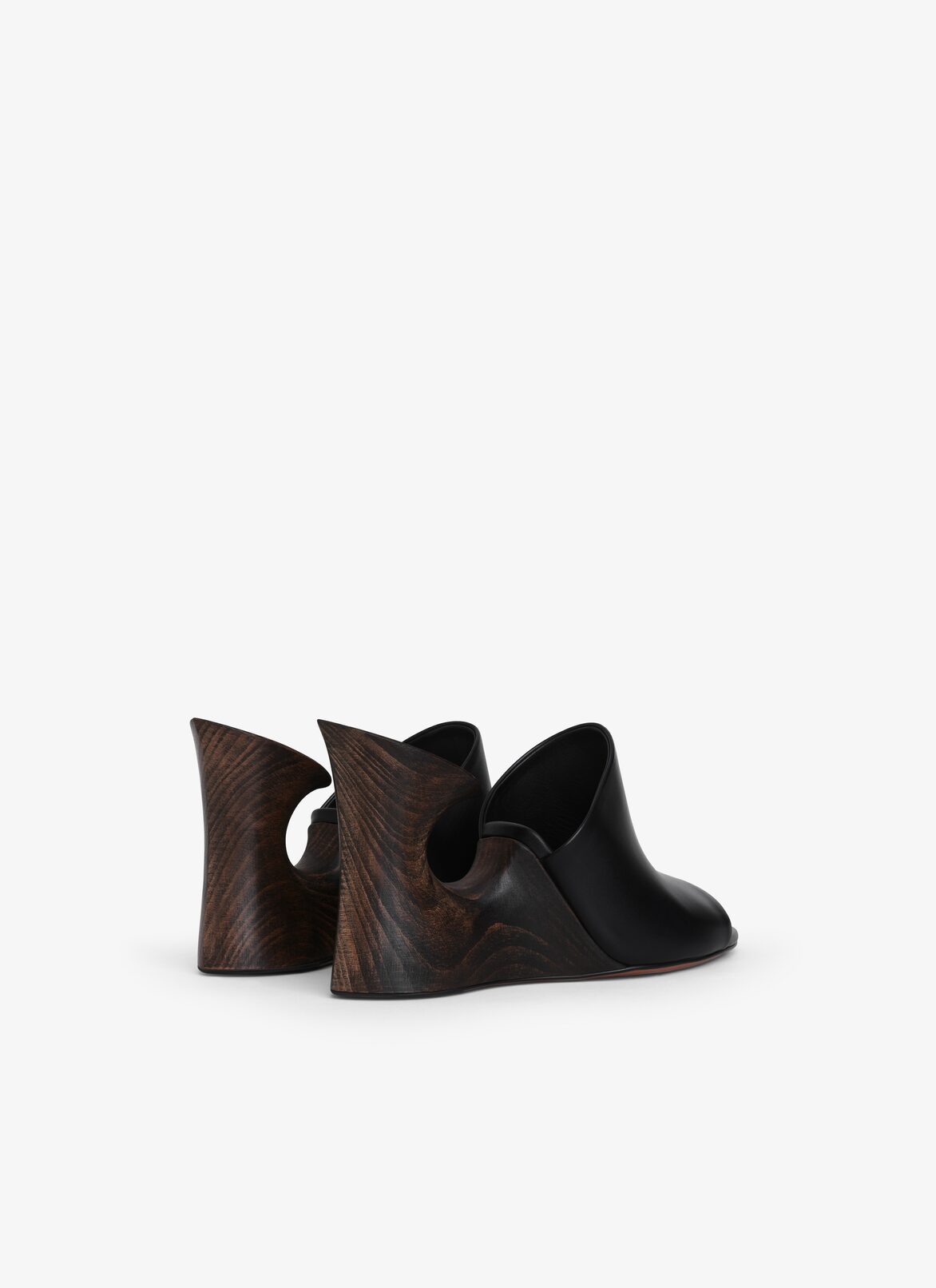 La Sculpture mules in calfskin & wood ALAÏA BLACK LA SCULPTURE MULES IN CALFSKIN & WOOD